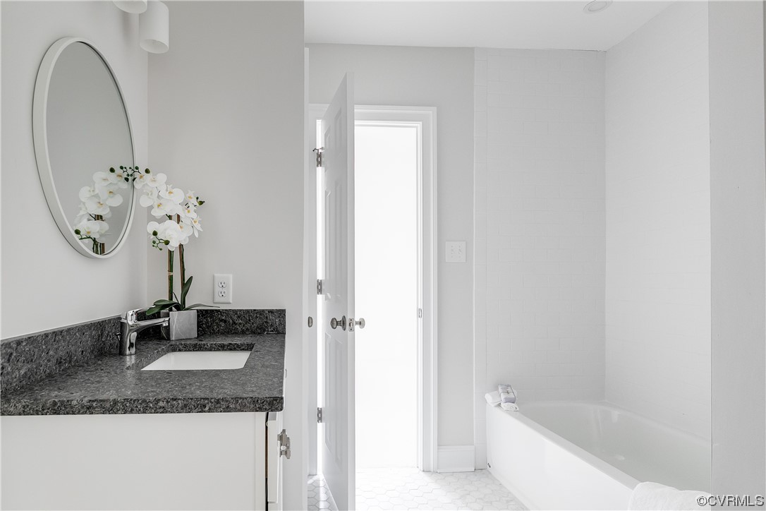 14221 West Salisbury Road Midlothian, VA 23113 - Photo 35 of 43 a bathroom with a granite countertop sink and a mirror