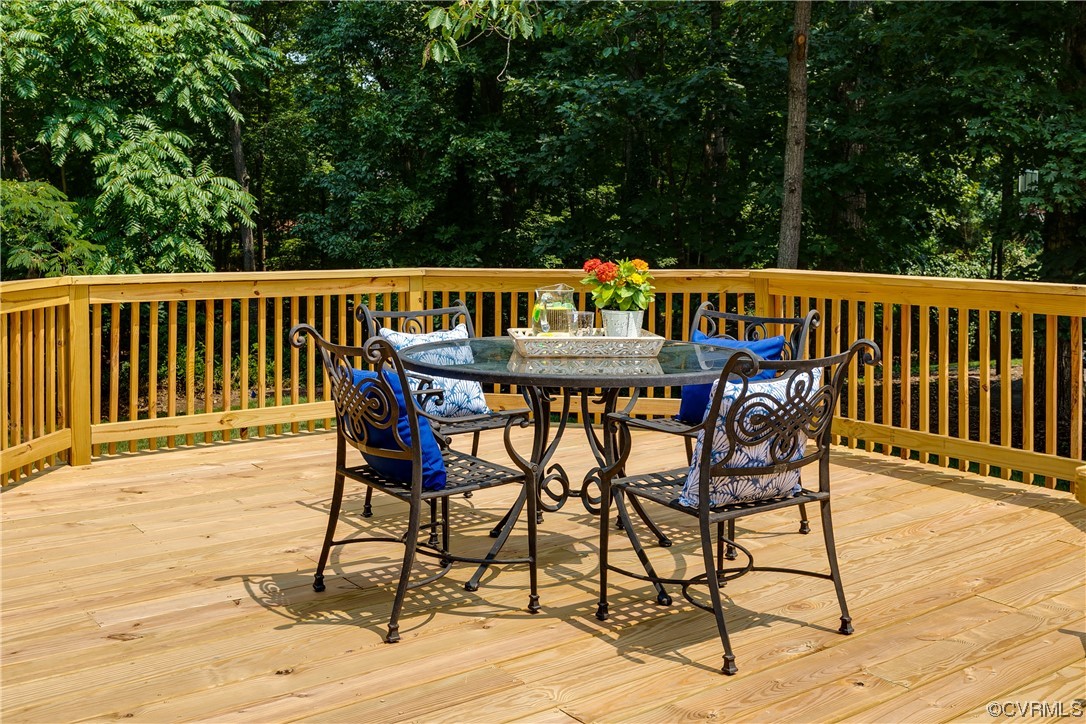 14221 West Salisbury Road Midlothian, VA 23113 - Photo 37 of 43 a patio of water with a table and chairs