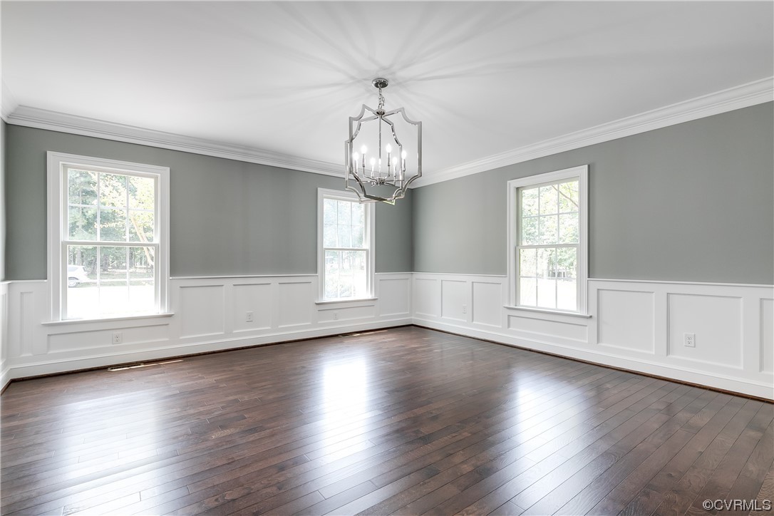 14221 West Salisbury Road Midlothian, VA 23113 - Photo 10 of 43 a view of an empty room with wooden floor and windows