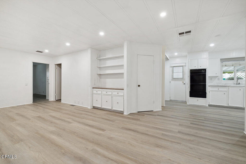 206 Browning Avenue, Unit 206 Ventura, CA 93003 - Photo 12 of 36 a view of an empty room with kitchen and window