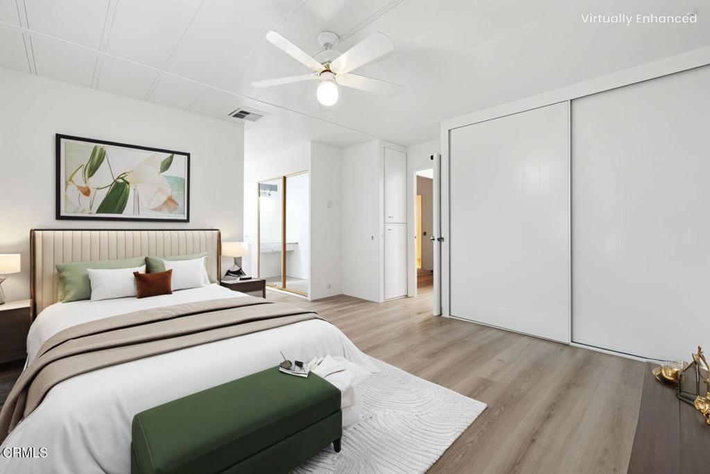 206 Browning Avenue, Unit 206 Ventura, CA 93003 - Photo 17 of 36 a bedroom with a bed and a painting on the wall