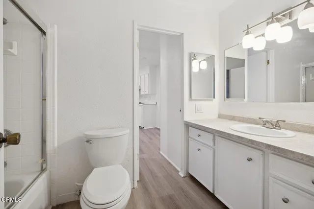 a bathroom with a sink and a large mirror