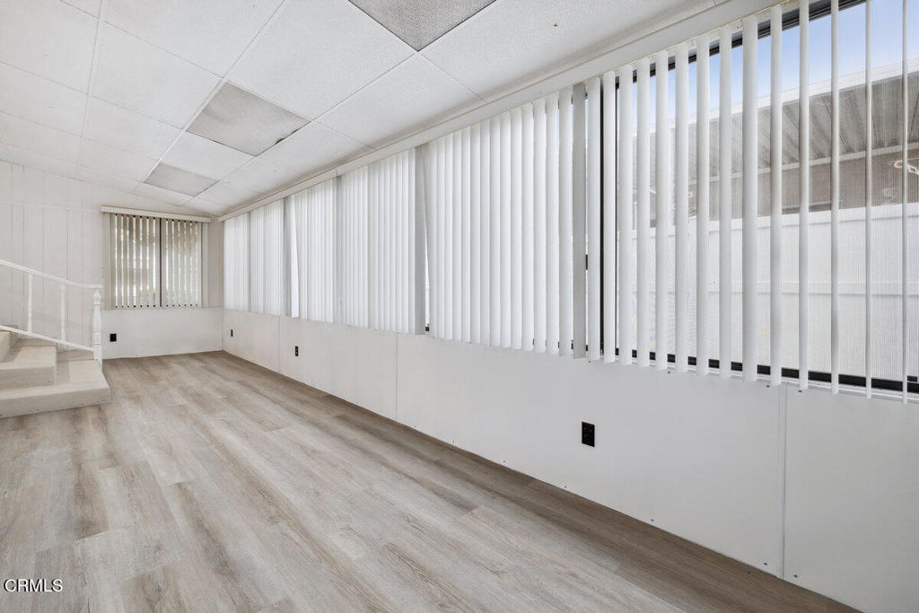 206 Browning Avenue, Unit 206 Ventura, CA 93003 - Photo 24 of 36 a view of an empty room with wooden floor