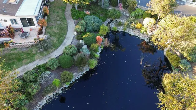 a view of street with flower on both side of house