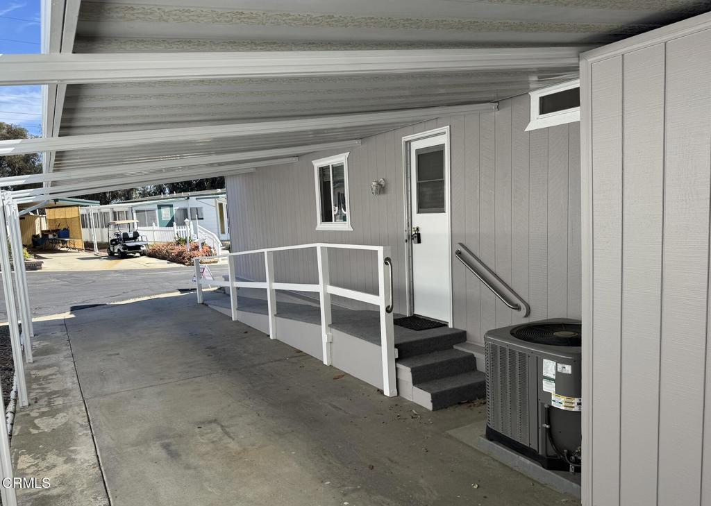 206 Browning Avenue, Unit 206 Ventura, CA 93003 - Photo 5 of 36 a view of an empty room with stairs