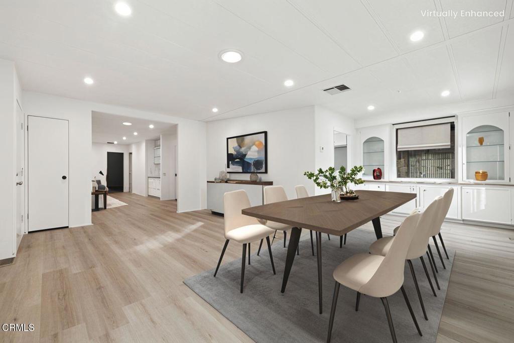 206 Browning Avenue, Unit 206 Ventura, CA 93003 - Photo 8 of 36 a view of a dining room with furniture and wooden floor