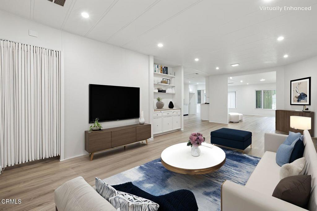 206 Browning Avenue, Unit 206 Ventura, CA 93003 - Photo 9 of 36 a living room with furniture and a flat screen tv