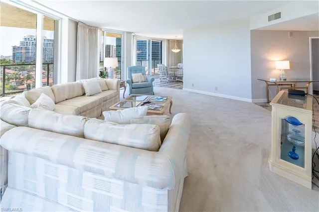 a kitchen with stainless steel appliances granite countertop a refrigerator a stove and a sink