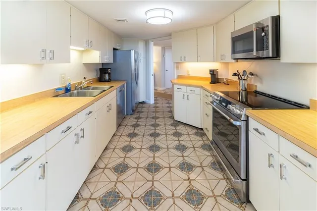 a dining room with furniture and a floor to ceiling window