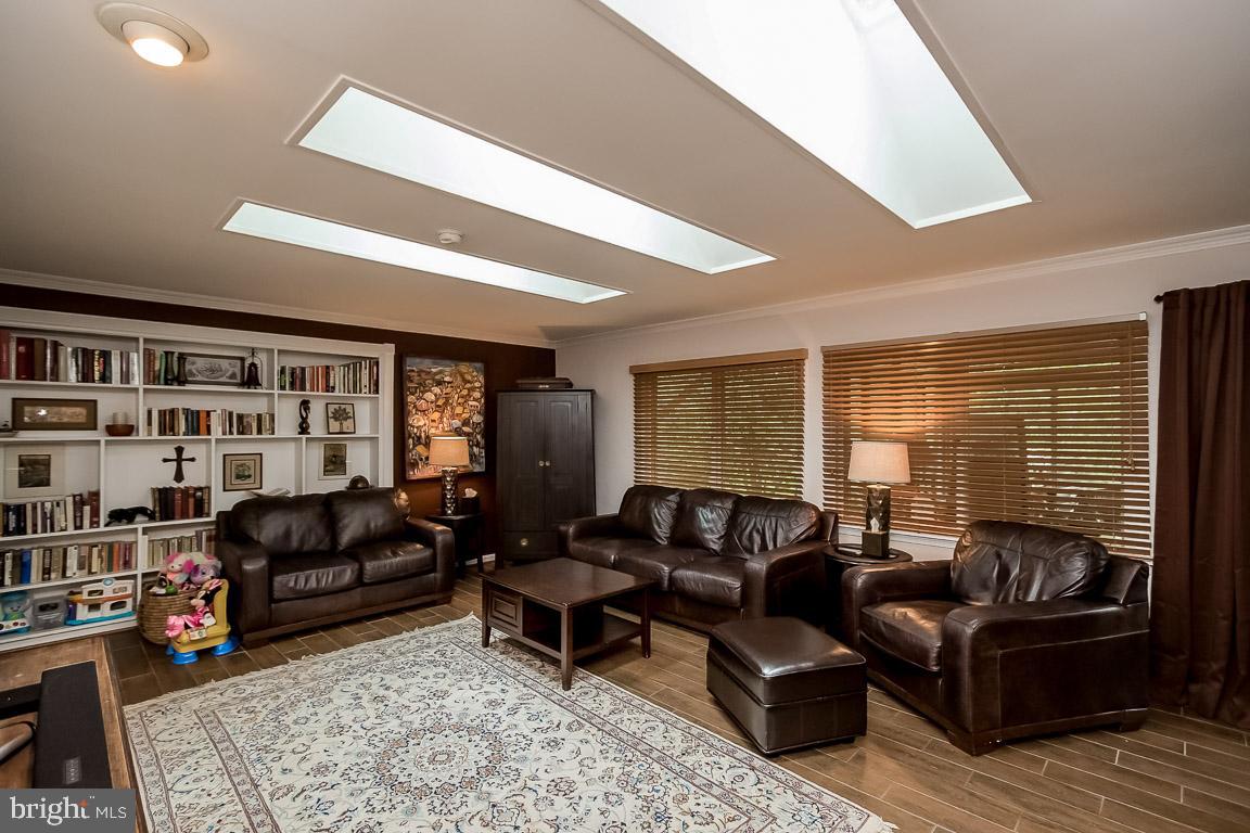 11241 South Shore Road Reston, VA 20190 - Photo 16 of 34 Built-in bookcases and SGD to Sun Room!