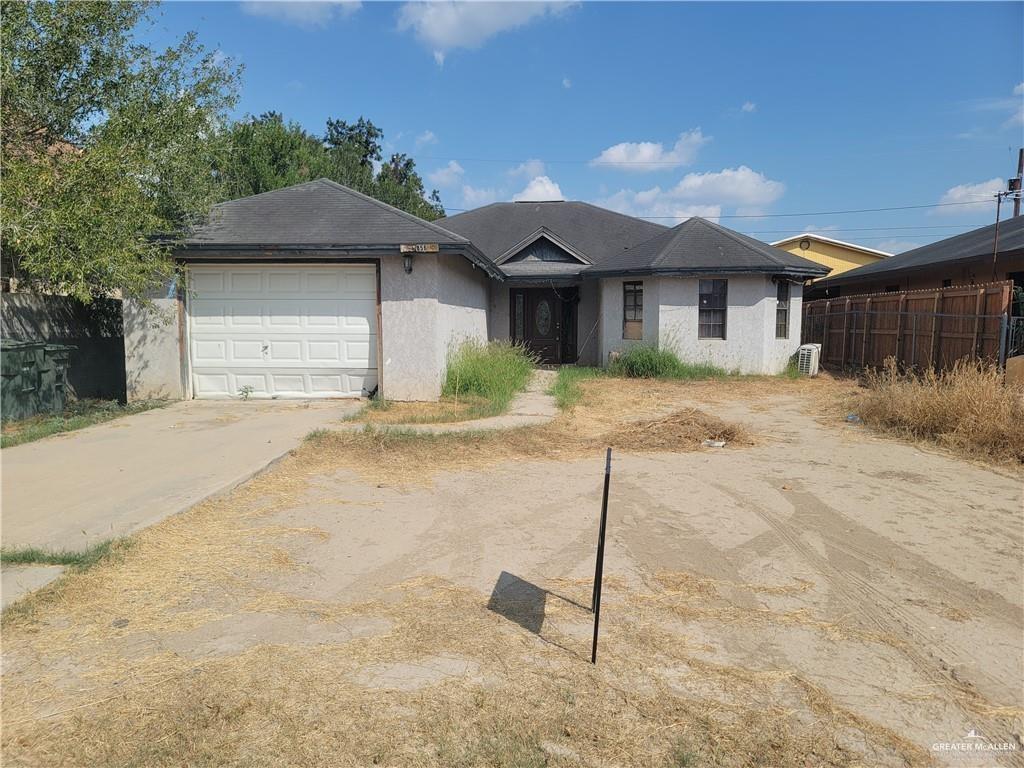 2856 Bronco Street Roma, TX 78584 - Photo 1 of 1 Ranch-style house featuring a garage, driveway, and stucco siding