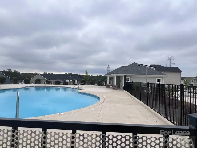 a view of swimming pool with furniture