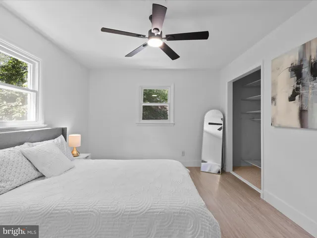 a bedroom with a large bed and a window