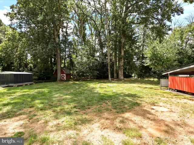 a view of swimming pool with a backyard