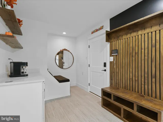 a view of a room with wooden floor and windows