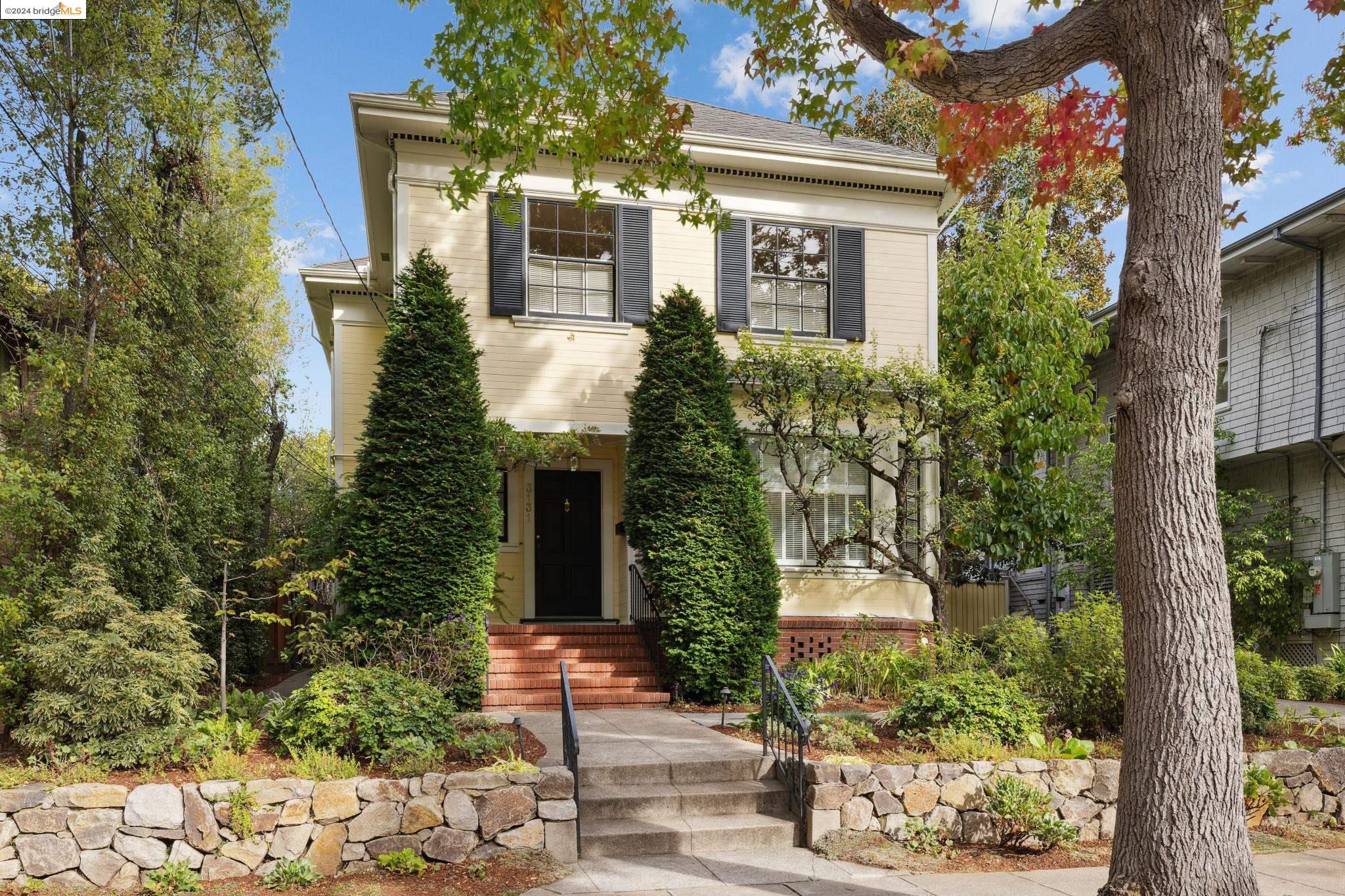 3131 Eton Avenue Berkeley, CA 94705 - Photo 1 of 1 a front view of a house with a tree in front