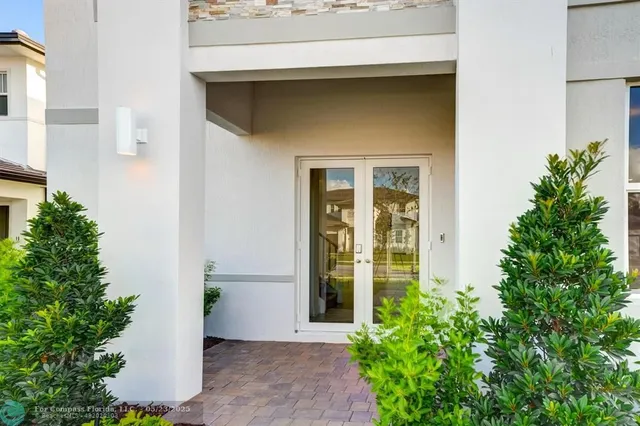 a bathroom with a sink a toilet a mirror and vanity