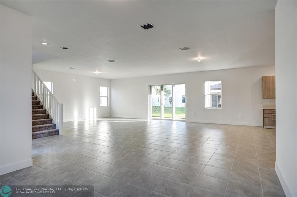 12328 Southwest 43rd Street Davie, FL 33330 - Photo 12 of 96 a view of empty room with wooden floor and stairs