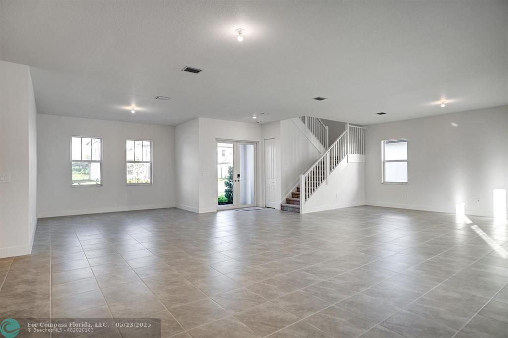 12328 Southwest 43rd Street Davie, FL 33330 - Photo 16 of 96 a view of an empty room with wooden floor and a window