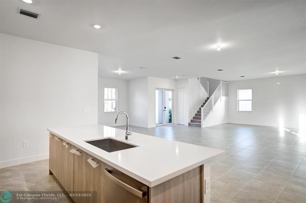 12328 Southwest 43rd Street Davie, FL 33330 - Photo 20 of 96 a kitchen with a sink a counter top space and cabinets