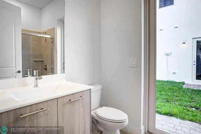 a white bath tub sitting next to a white toilet