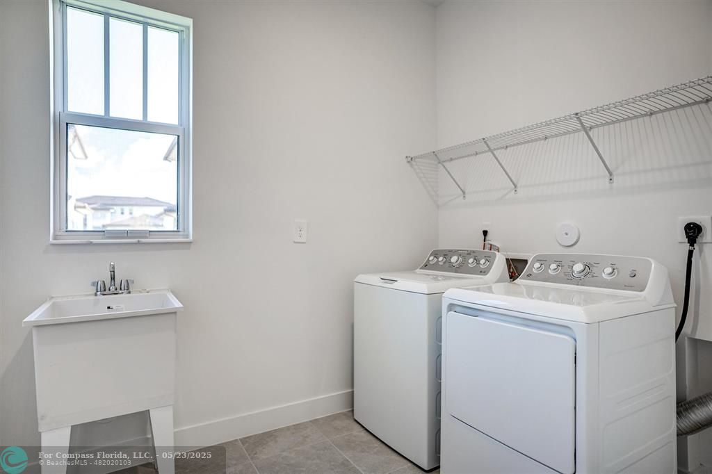 12328 Southwest 43rd Street Davie, FL 33330 - Photo 25 of 96 a utility room with dryer and washer