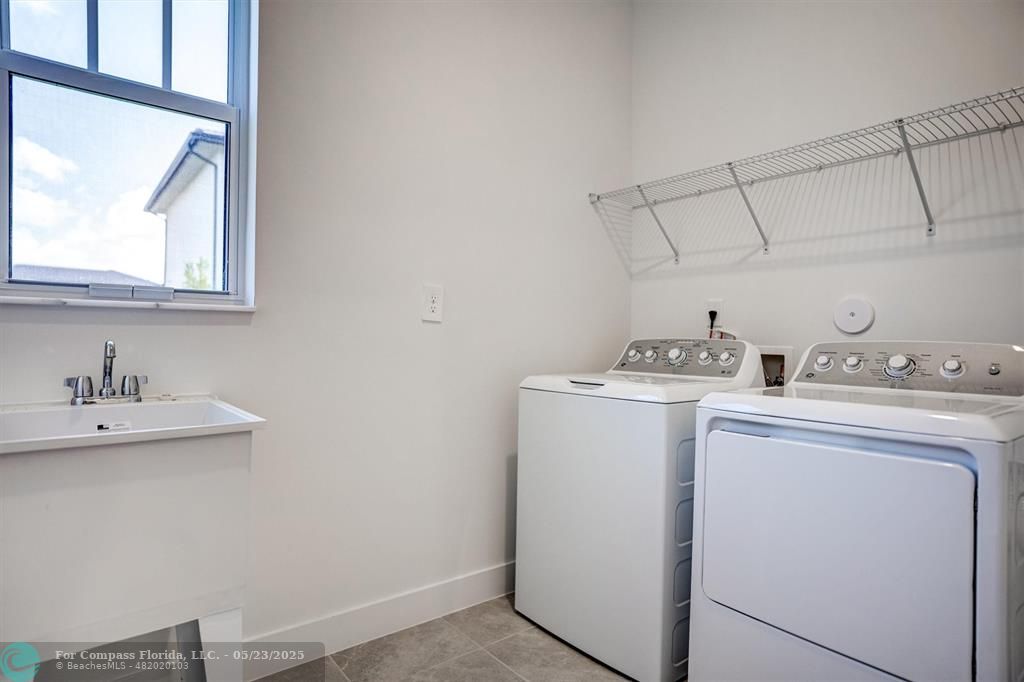 12328 Southwest 43rd Street Davie, FL 33330 - Photo 26 of 96 a utility room with dryer and washer
