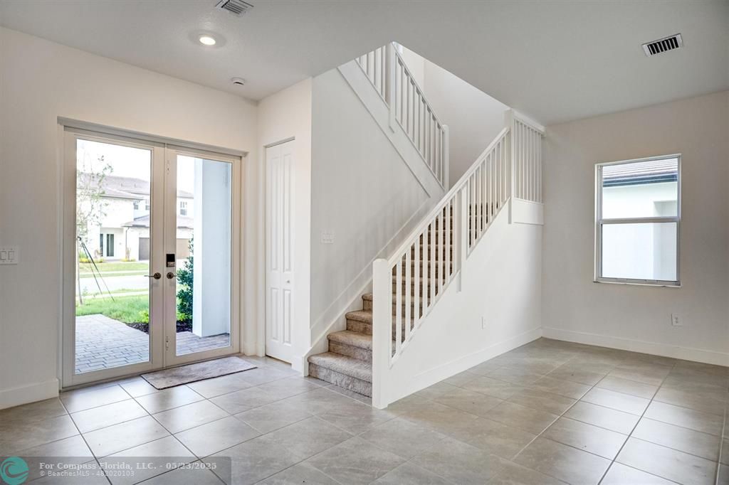 12328 Southwest 43rd Street Davie, FL 33330 - Photo 27 of 96 a view of entryway and hall with a window