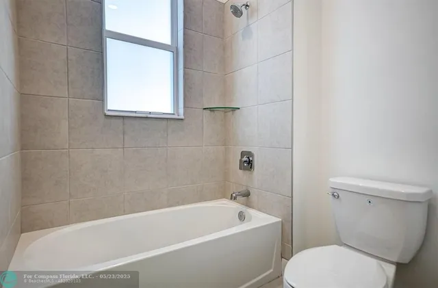 an aerial view of residential houses with yard