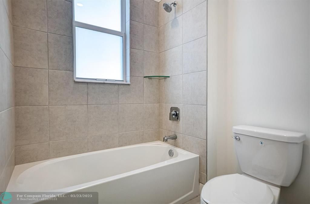 12328 Southwest 43rd Street Davie, FL 33330 - Photo 33 of 96 a white bath tub sitting next to a white toilet