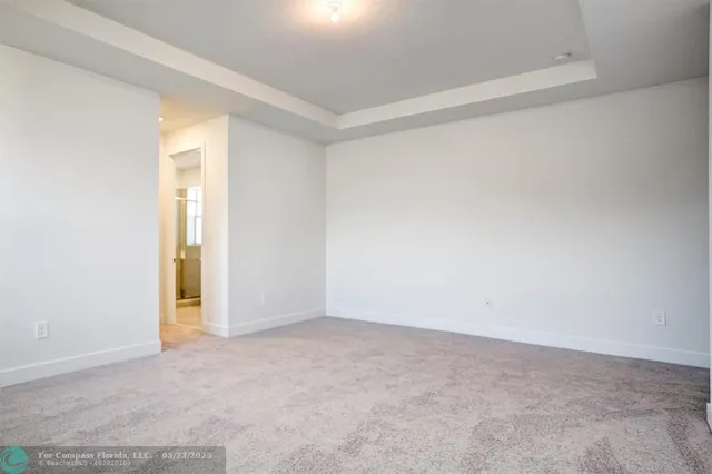 a bedroom with bed and a window