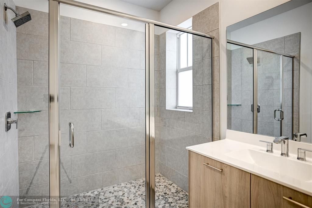 12328 Southwest 43rd Street Davie, FL 33330 - Photo 47 of 96 a bathroom with a sink and a mirror