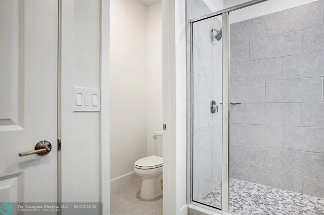 a kitchen with stainless steel appliances a refrigerator sink and microwave