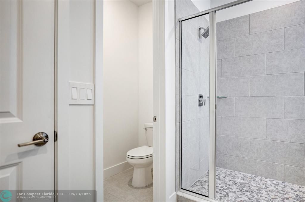 12328 Southwest 43rd Street Davie, FL 33330 - Photo 48 of 96 a bathroom with a toilet and shower