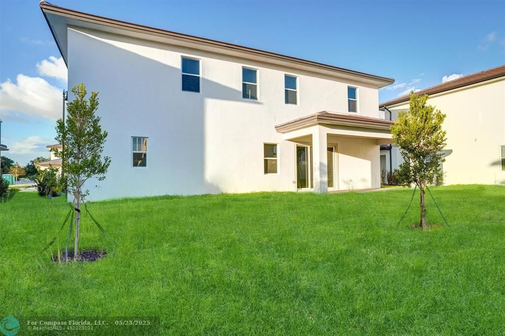 12328 Southwest 43rd Street Davie, FL 33330 - Photo 54 of 96 a front view of a house with a yard