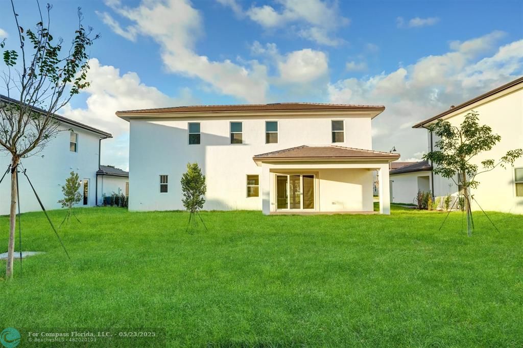 12328 Southwest 43rd Street Davie, FL 33330 - Photo 55 of 96 a front view of a house with a yard