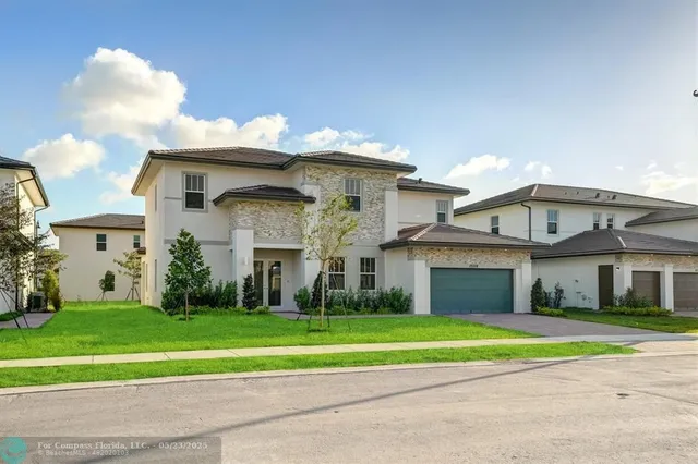 a front view of a house with a garage