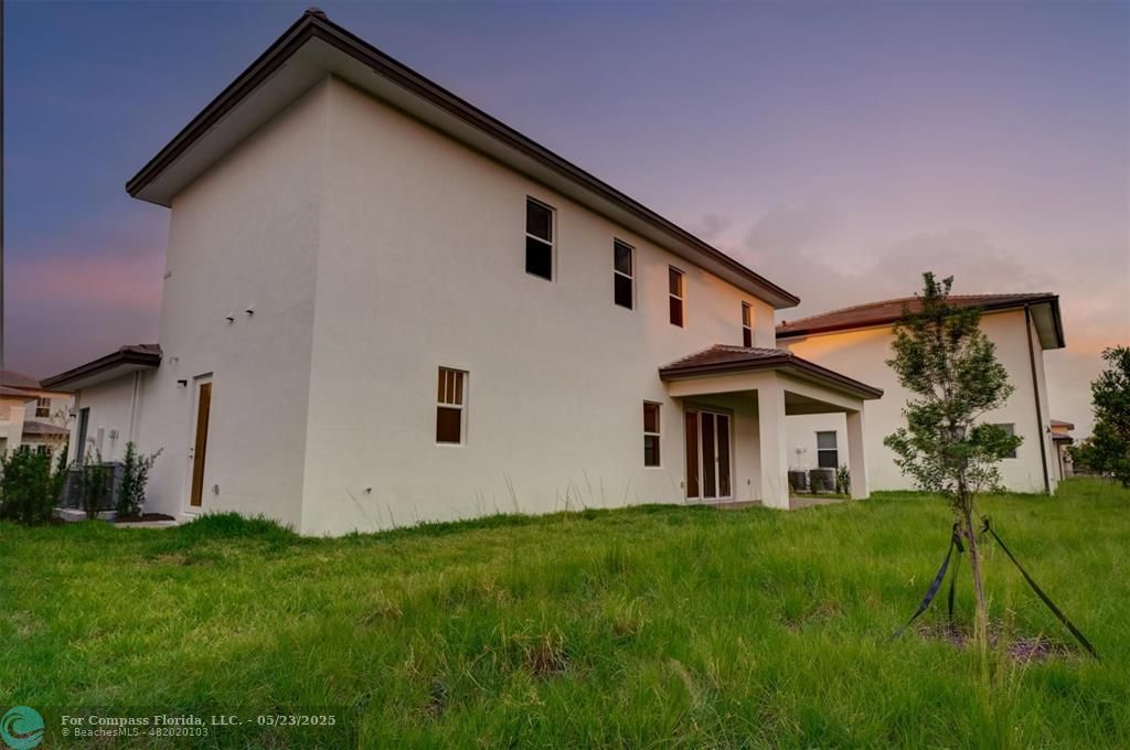 12328 Southwest 43rd Street Davie, FL 33330 - Photo 83 of 96 a front view of house with yard and green space