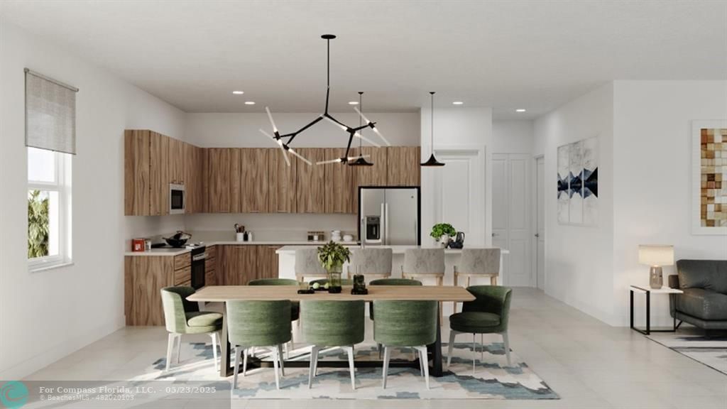 12328 Southwest 43rd Street Davie, FL 33330 - Photo 90 of 96 a kitchen with kitchen island stainless steel appliances a dining table chairs sink and cabinets