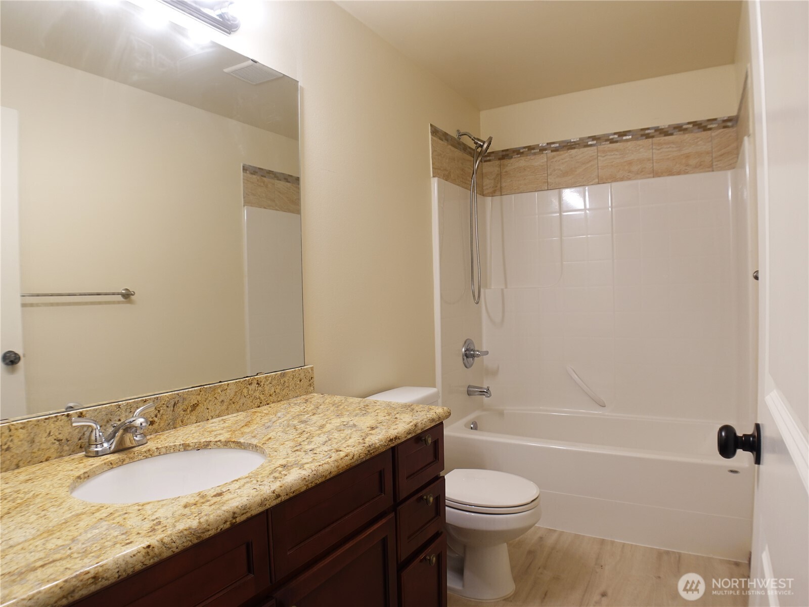 5451 32nd Avenue Southwest Seattle, WA 98126 - Photo 30 of 35 a bathroom with a granite countertop sink toilet and shower