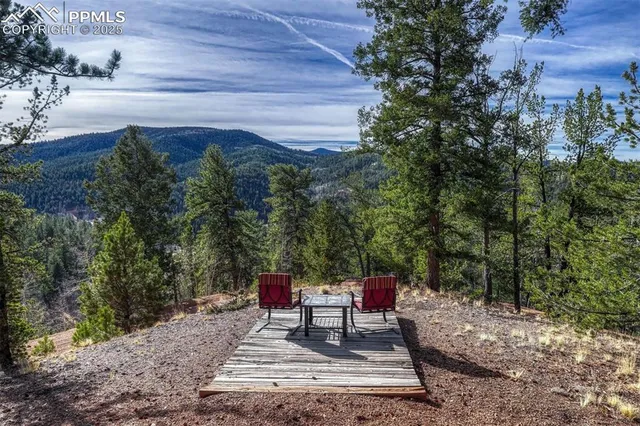 a view of a backyard with sitting area