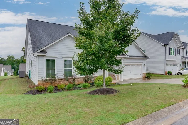 front view of a house with a yard