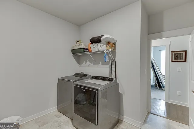 a view of storage and utility room with washer and dryer