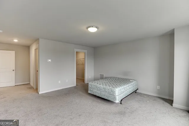 a living room with a bed and a couch