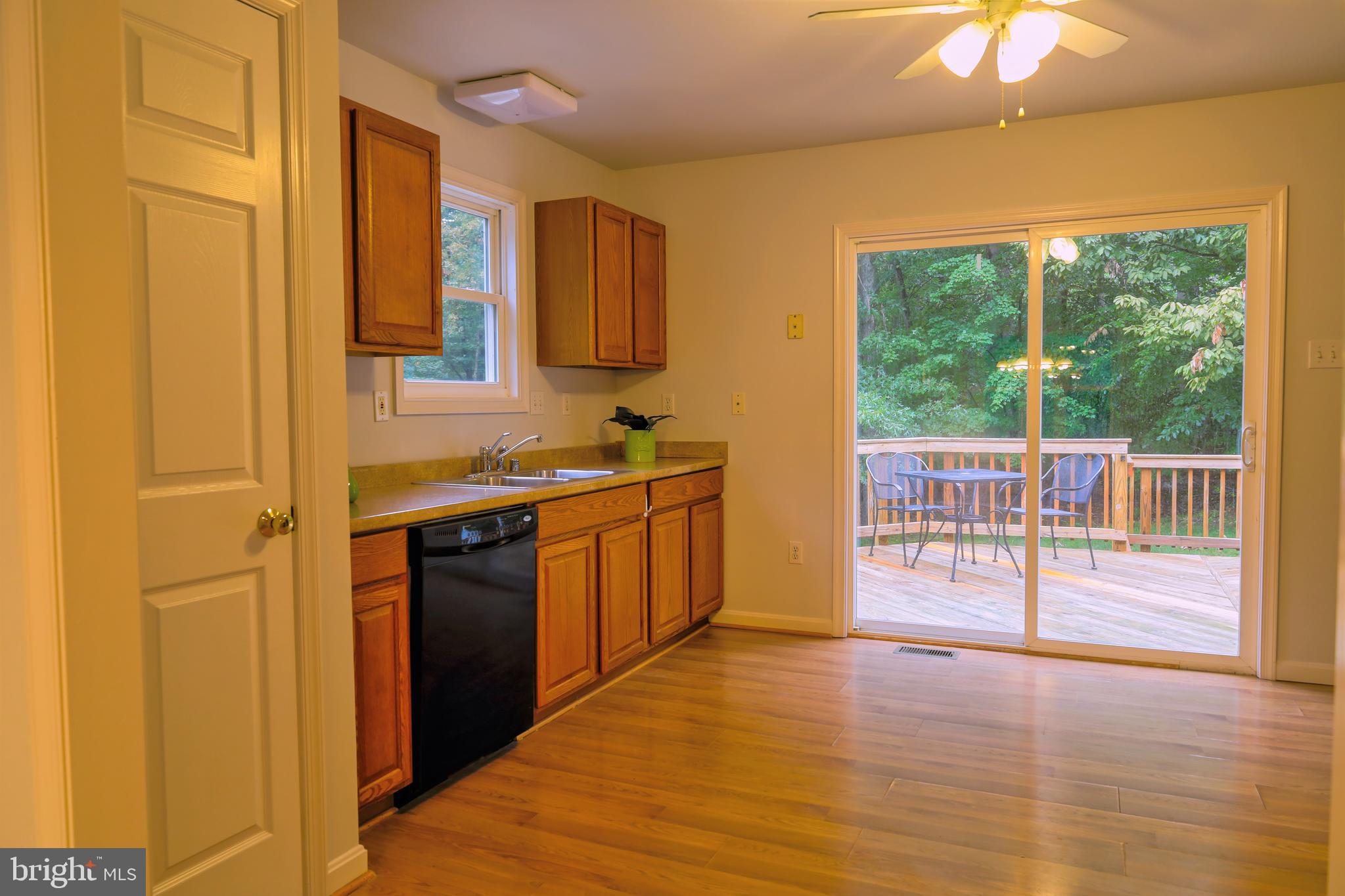 7404 Dance Hall Road Frederick, MD 21701 - Photo 45 of 55 In-law home kitchen showing glass doors to deck