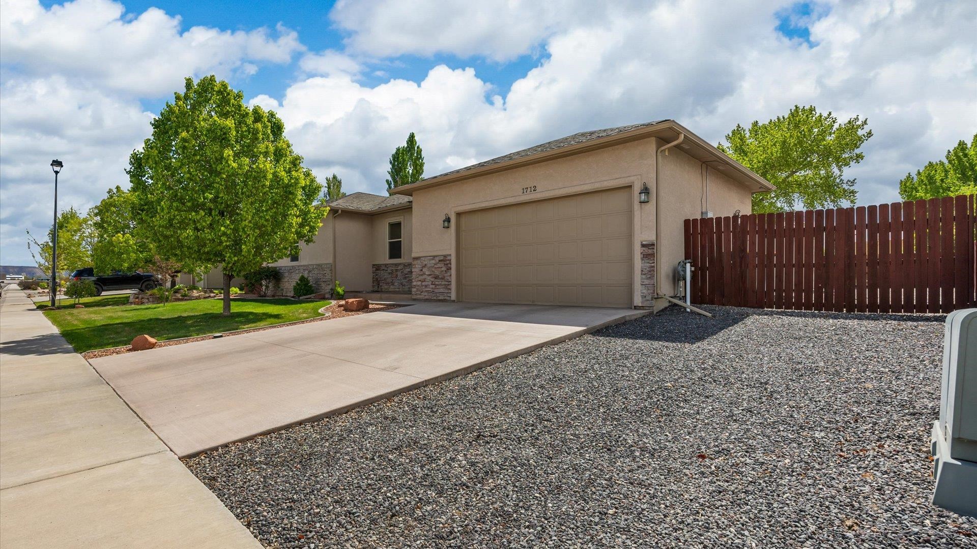 1712 Powis Lane Fruita, CO 81521 - Photo 2 of 39 a house with a yard