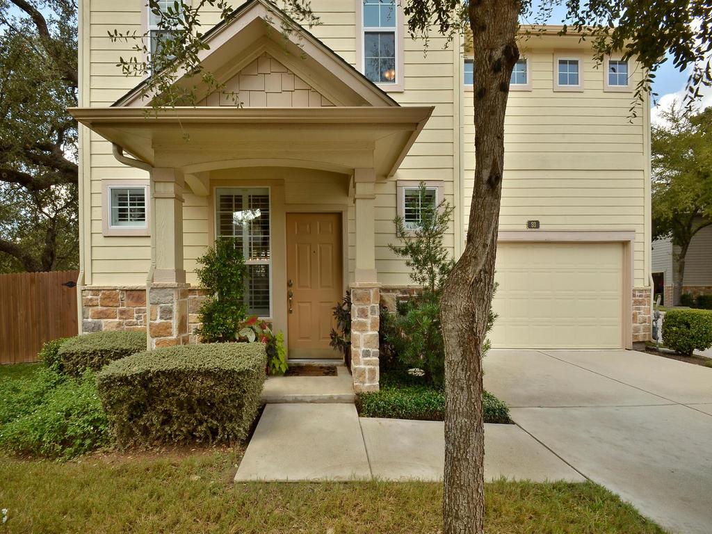 11000 Anderson Mill Road, Unit 93 Austin, TX 78750 - Photo 27 of 27 A welcoming front entrance with stone accents, covered porch, and convenient attached garage.