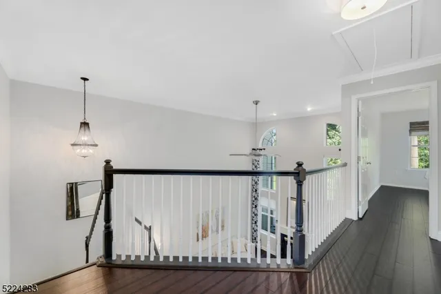 a view of hallway with wooden floor