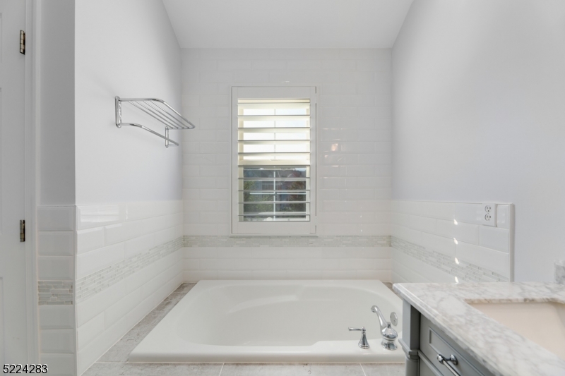 13 Knox Court Bernards, NJ 07920 - Photo 12 of 16 a white bath tub sitting next to a window