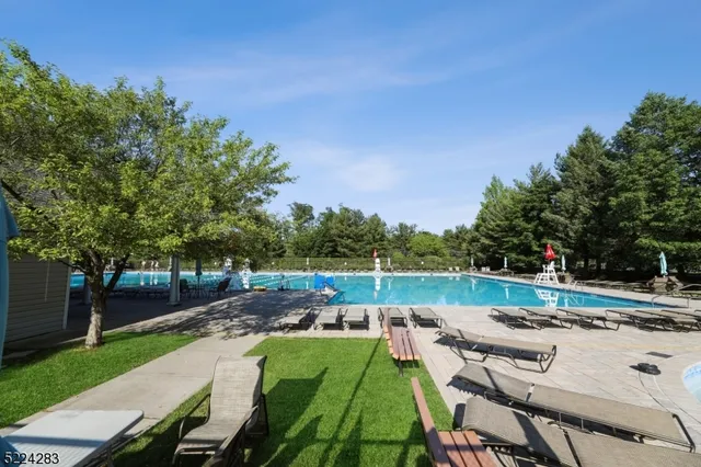 a view of a backyard with sitting area